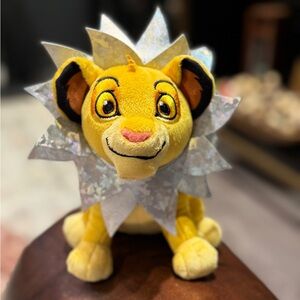 Disney 100th Anniversary Yellow Plush with Purple Badge